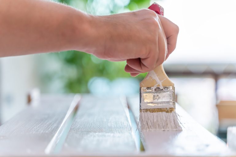 man-s-hand-paints-wooden-furniture-with-white-pain-2025-03-09-04-08-00-utc